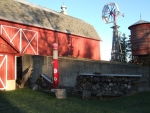 Shadow of mill on barn.