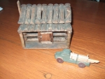 Log cabin and truck