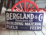 Enamel Bergland Feed's sign